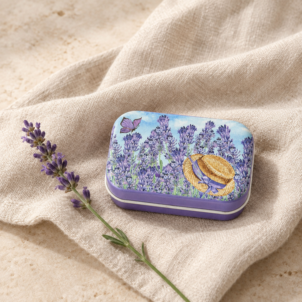Bee Calm Balm lavender tin styled on natural linen with a lavender stem