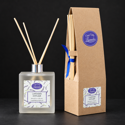 Giftable diffuser and kraft packaging on a dark background
